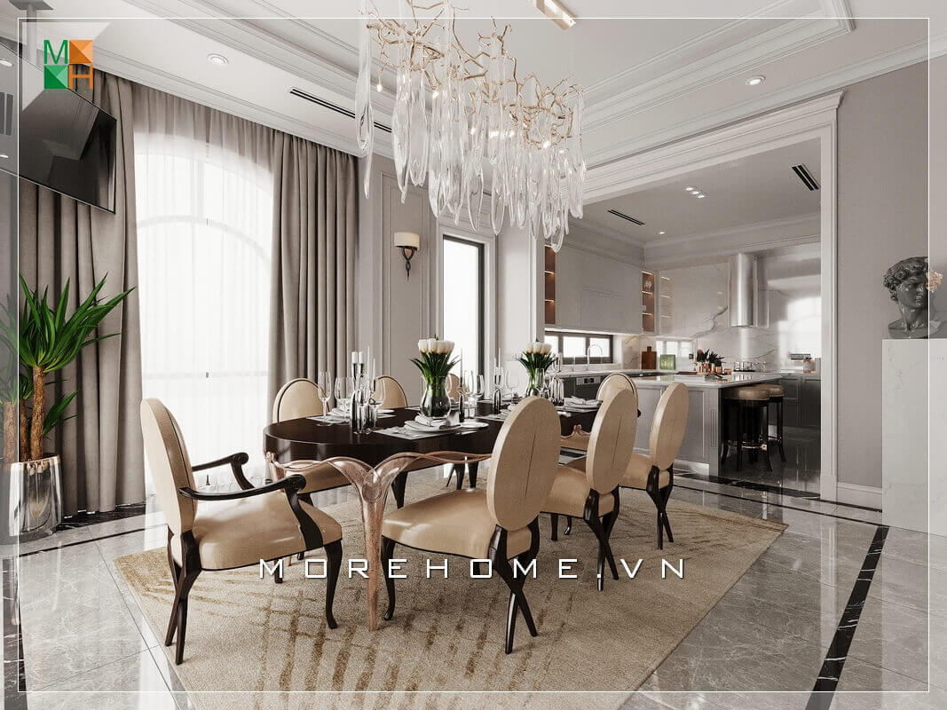 Thiết kế không gian phòng bếp liền phòng ăn rất rộng rãi và thoáng mát, sử dụng đèn chùm treo giữa không gian bàn ăn mang đậm chút tân cổ điện rất đẳng cấp. Thiết kế phòng ăn biệt thự